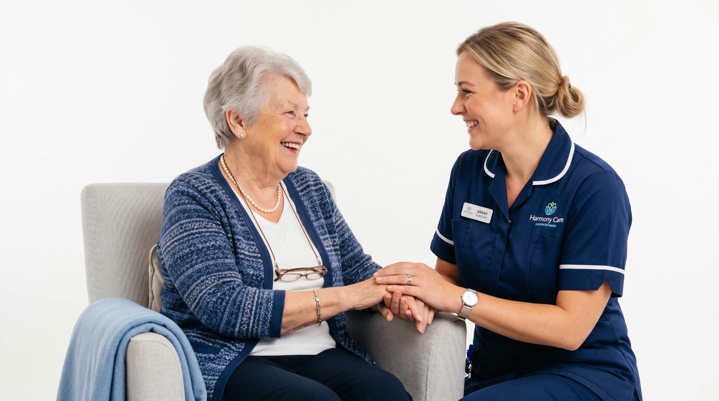 Care worker holding hands with elderly client